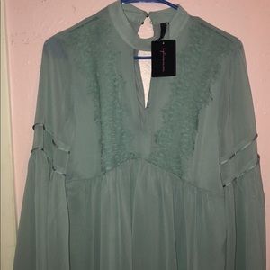 Sheer teal mock neck top!